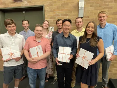 nine award winners standing together