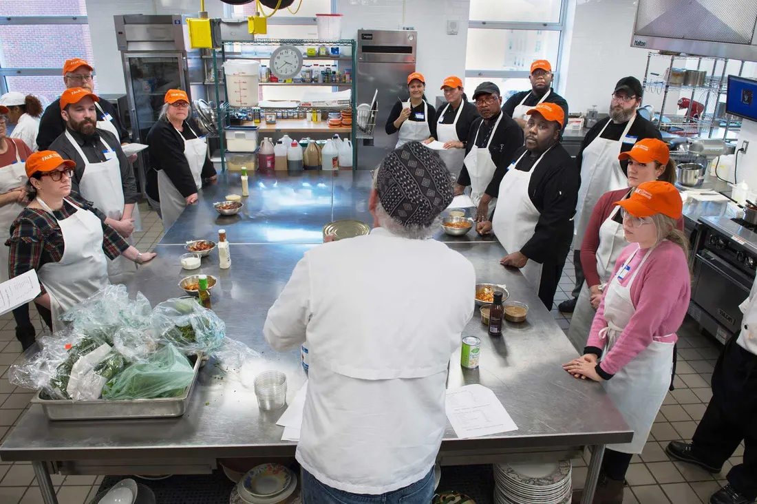 Chef Collins talks with attendees of his workshop