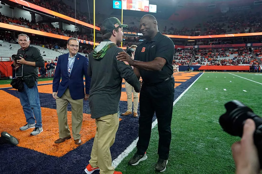 david and coach babers on the athletic field