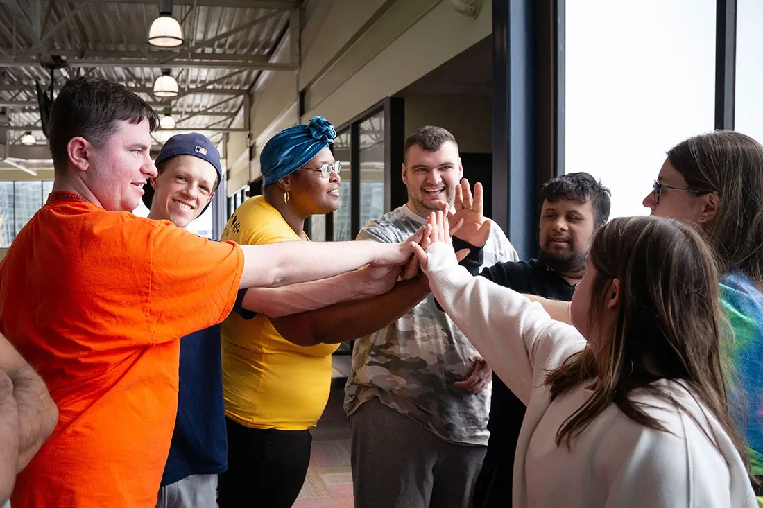students give each other a high 5
