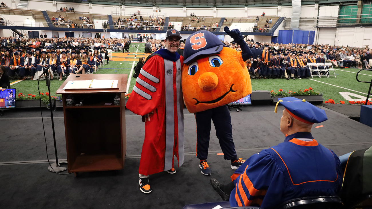 Dean Jordan on stage with Otto at convocation 2026