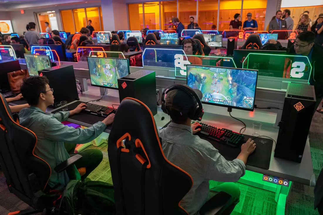 students playing games and computer consoles