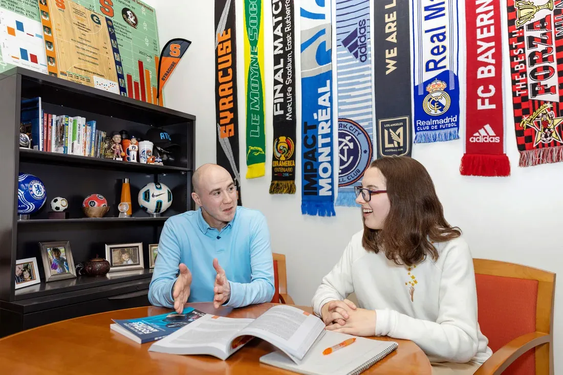 A student is counseled by an advisor