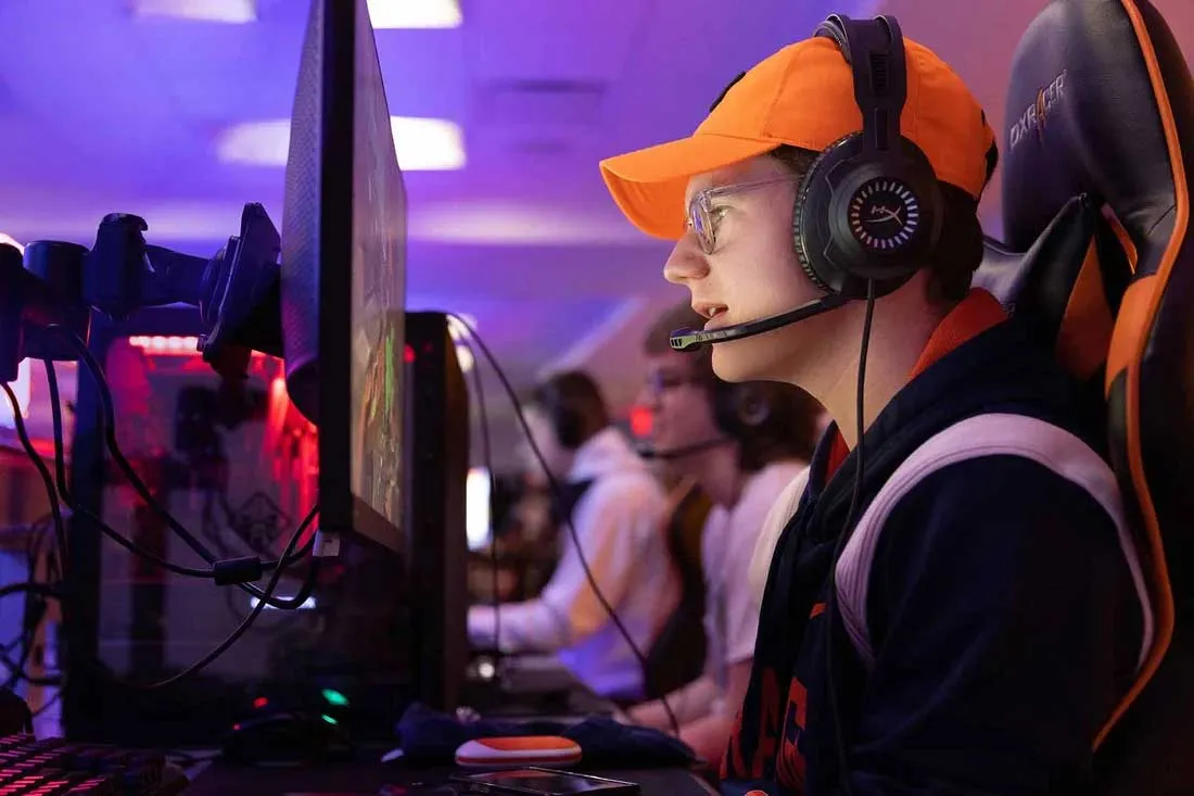 student playing at gaming station