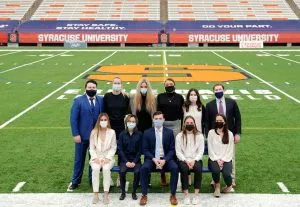 students gathered on football field