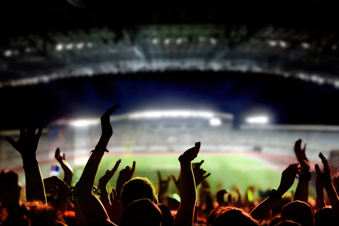 spectator view of soccer stadium at night