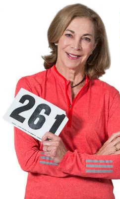 Katherine Switzer holds her original running bib for the Boston Marathon