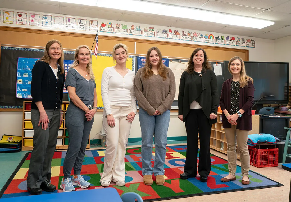 group of professors visiting pre-k class