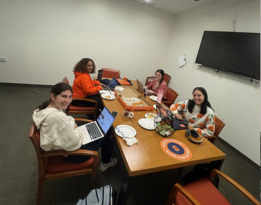 women with drive sitting around the table