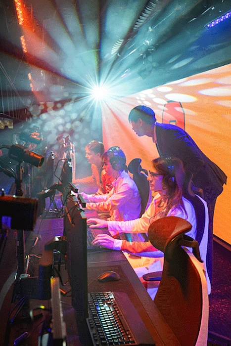 students at gaming stations at new esports center