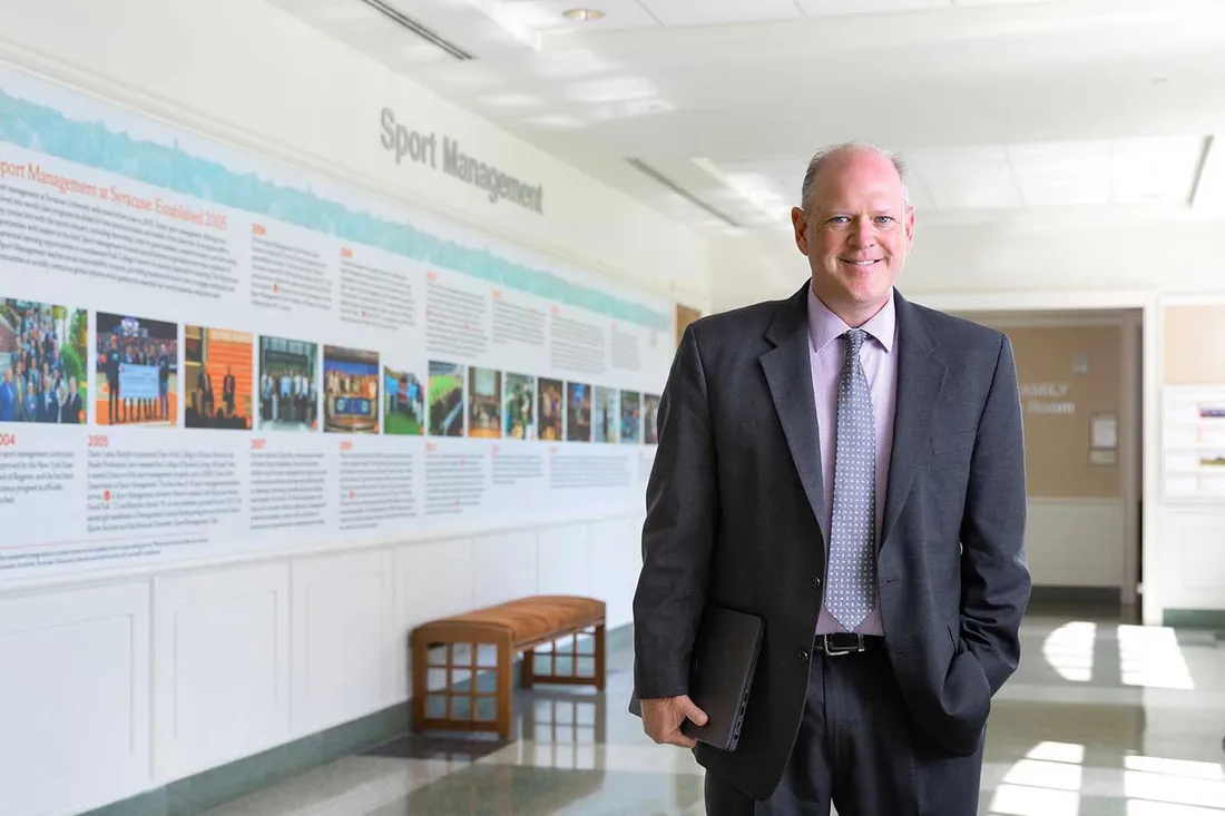 Professor Paul standing in front of classroom