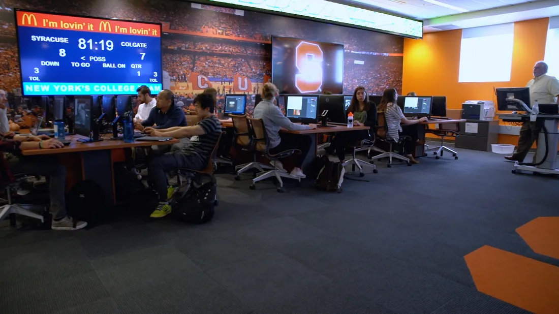 the Milton Conrad Sport Technology Lab showing tables of computers and large screens