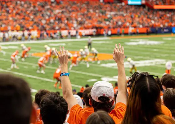 Attendees and athletic field shown during game between Syracuse and Notre Dame