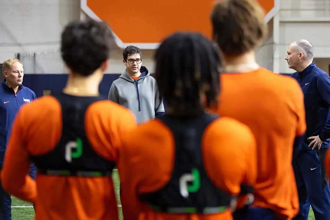 Coach talking to soccer players