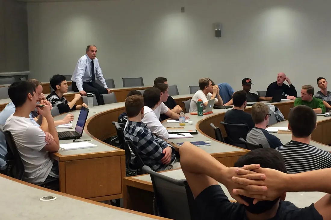 Rick Burton standing in back of his classroom