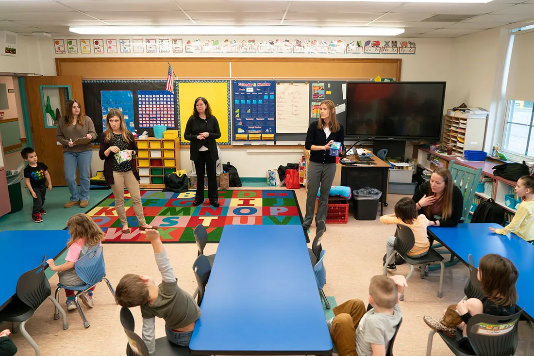 professor talks to prek class