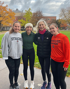 WISE members standing with alumna Kathrine Switzer
