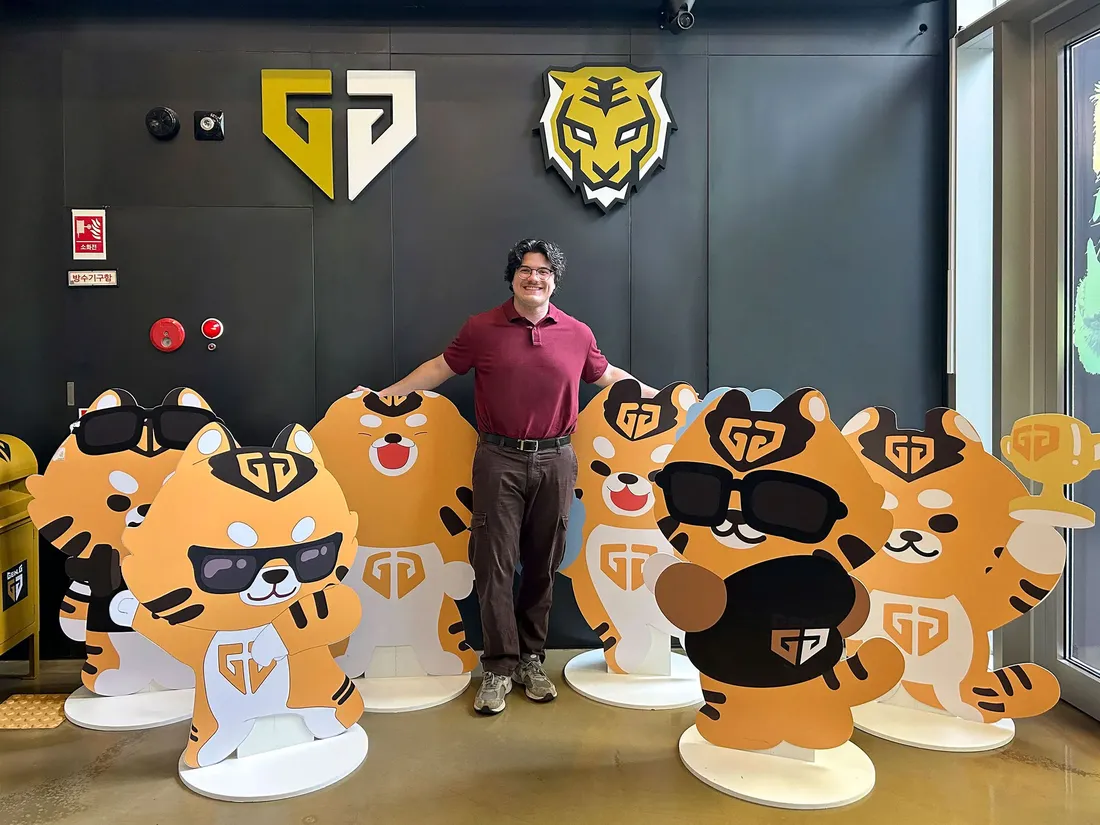 Dan Liscum standing with six cutout bears depicting Gen.G