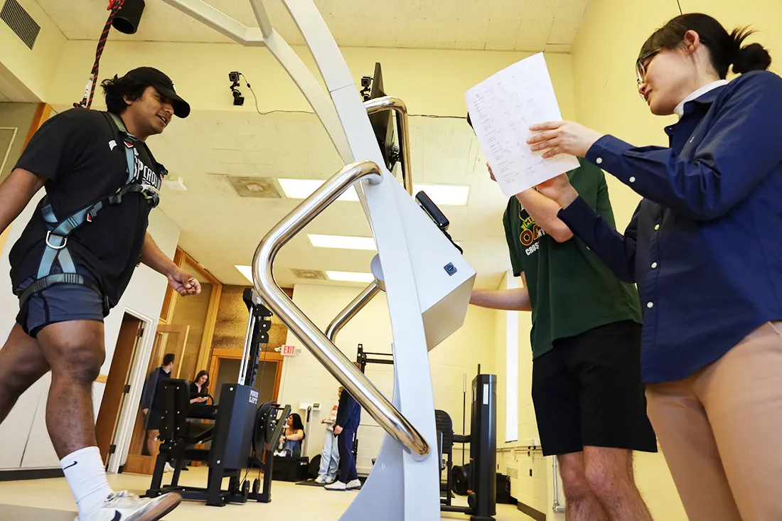 student on treadmill being monitored