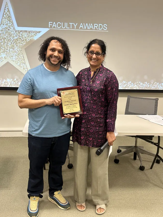 Ambika Krishnakumar presenting award to Joey Merrin