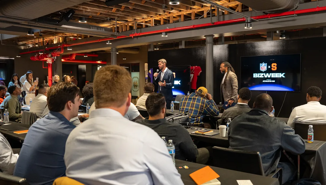 Former NFL players listen to a presentation during NFL Biz Week