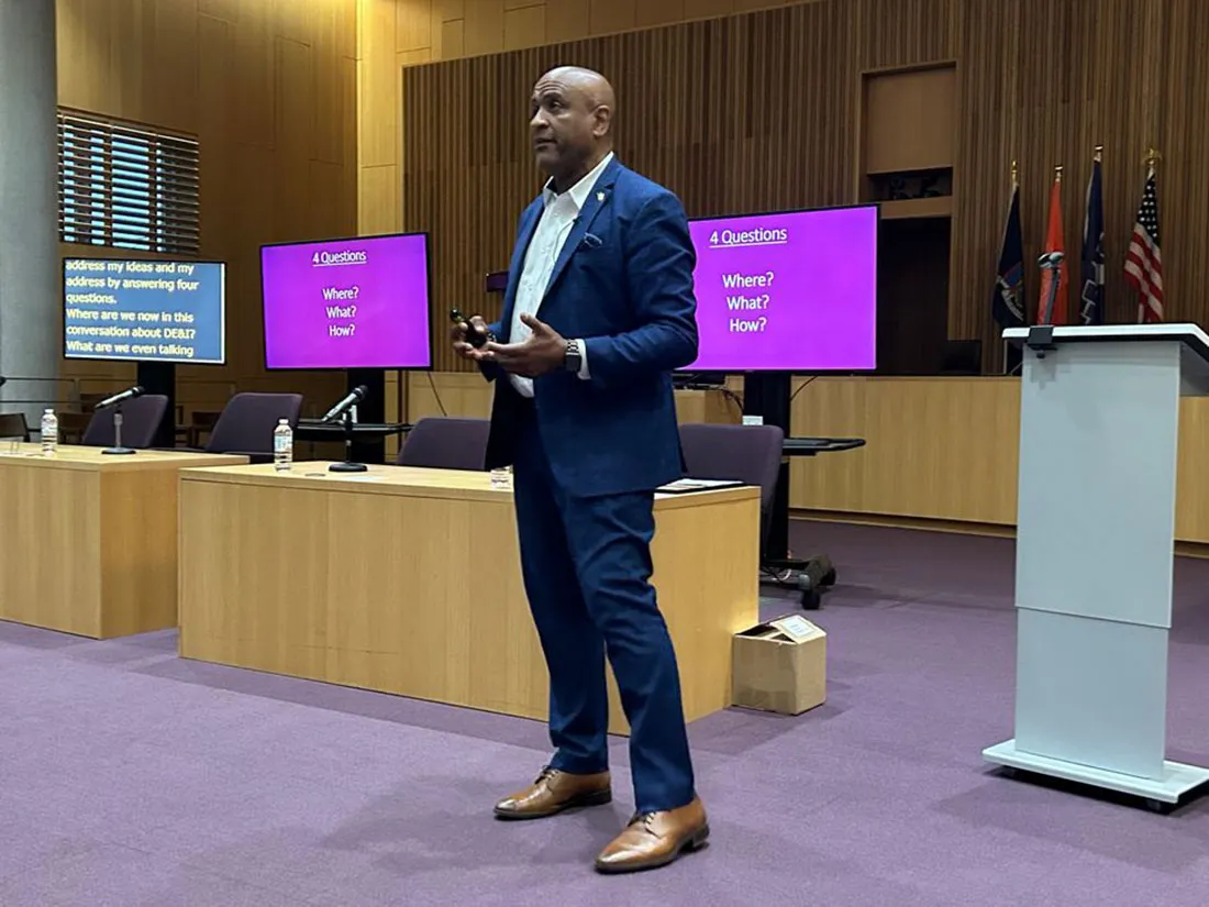 keynote speaker presenting at front of room