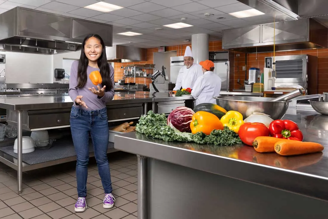 A student in the professional kitchens