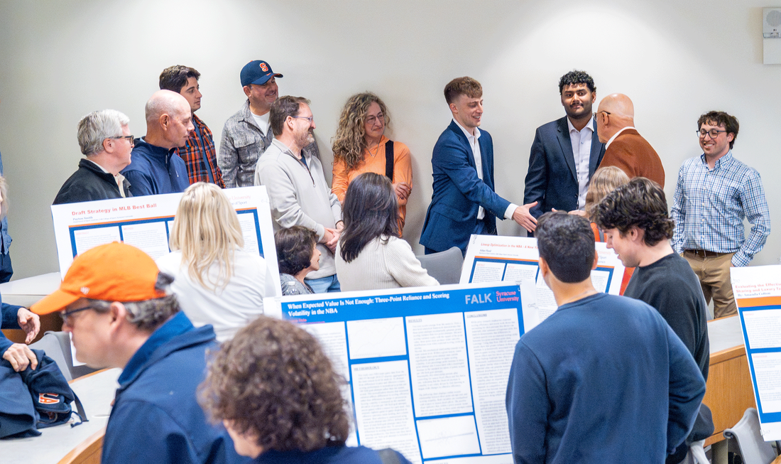 multiple students presenting their posters