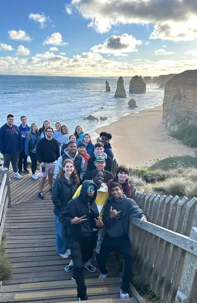 SU students walking the Great Ocean Road in Australia