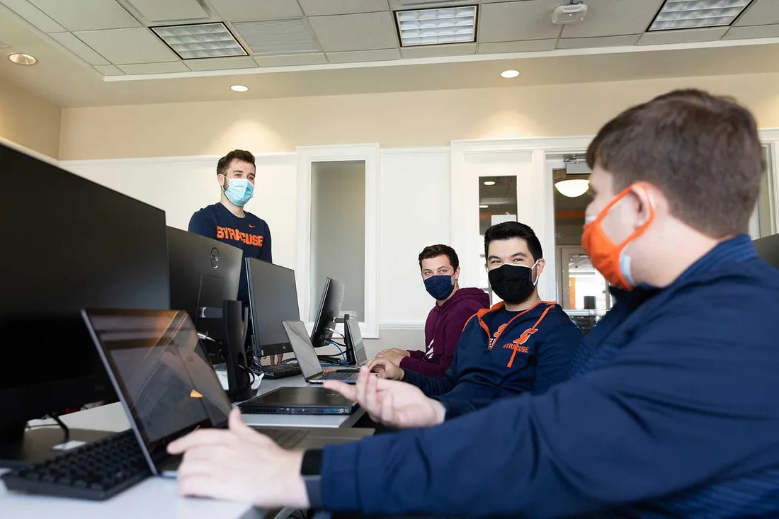 Professor talking to sports analytics students.