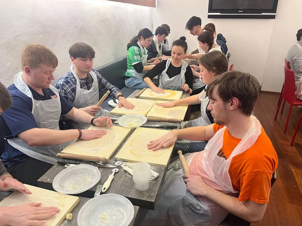 students preparing food in Italy