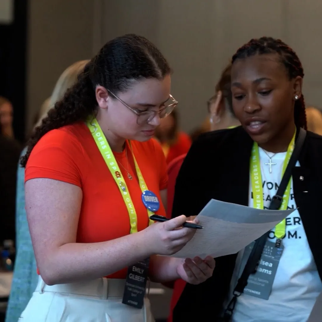 Emily Gilbert talks with another student at an event