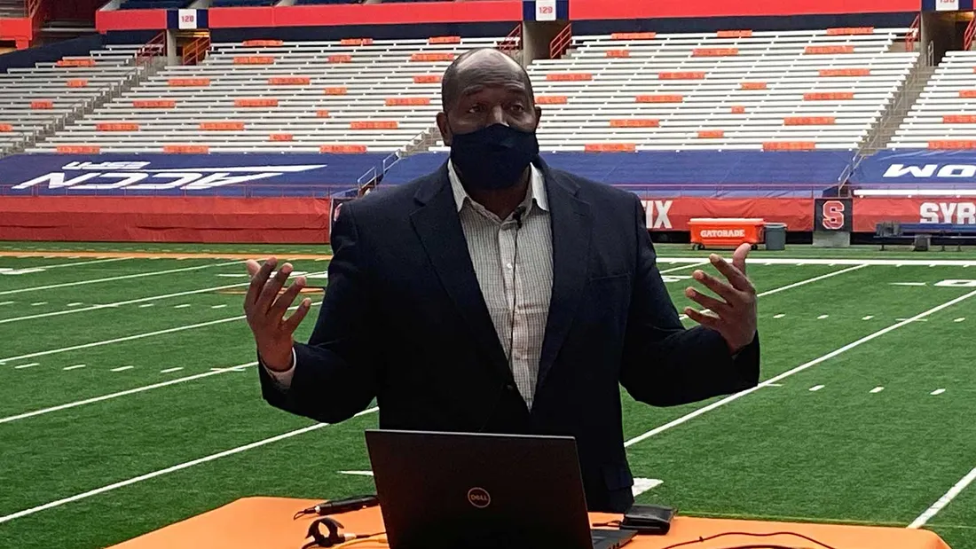 Dr. Willis standing on athletic field