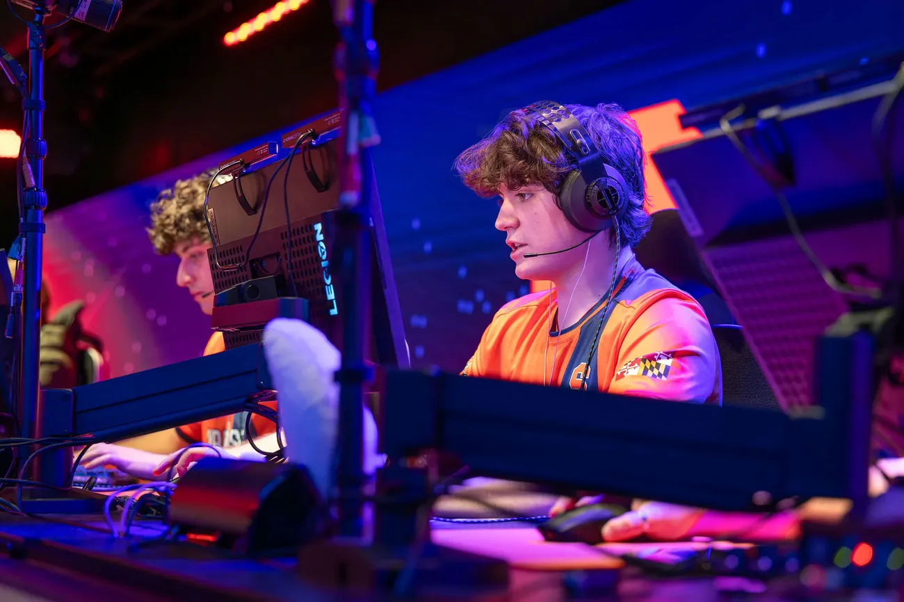 students sitting at stations in gaming center