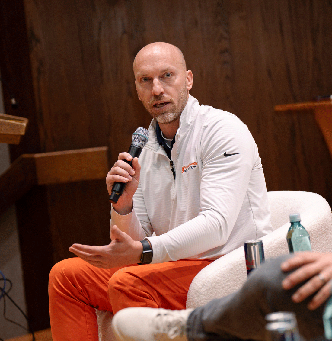joey g. sitting down with mic in hand
