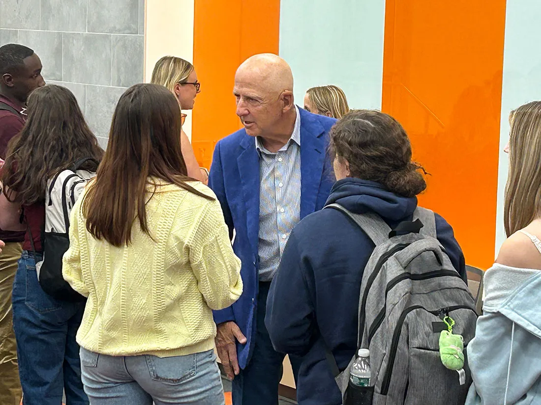students talking to David Falk