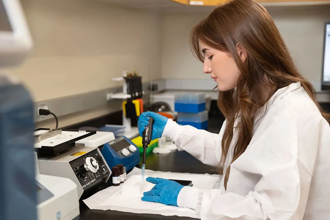 A student works in a biology lab