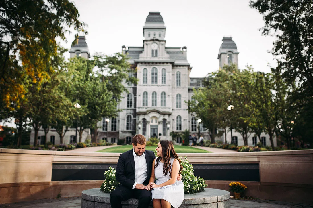 Hannah and Luke Rafferty on their wedding day sitting in front of Hall of Languages
