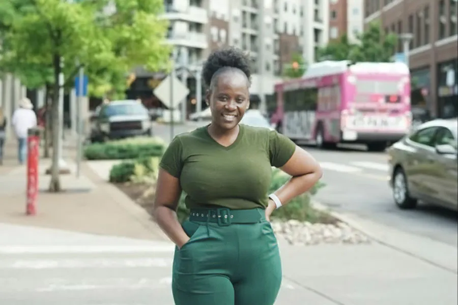 woman walking down sidewalk