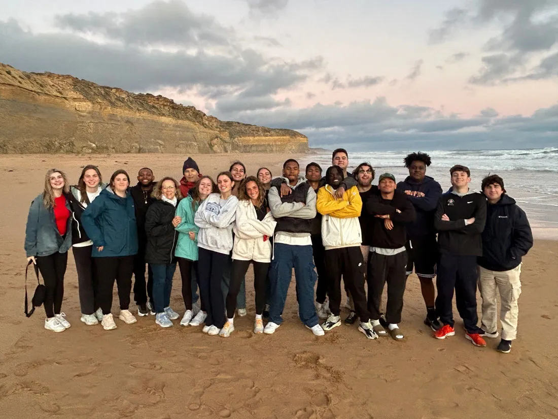 Nineteen students standing on the beach who attended the class, Australia: Sport, History and Culture class
