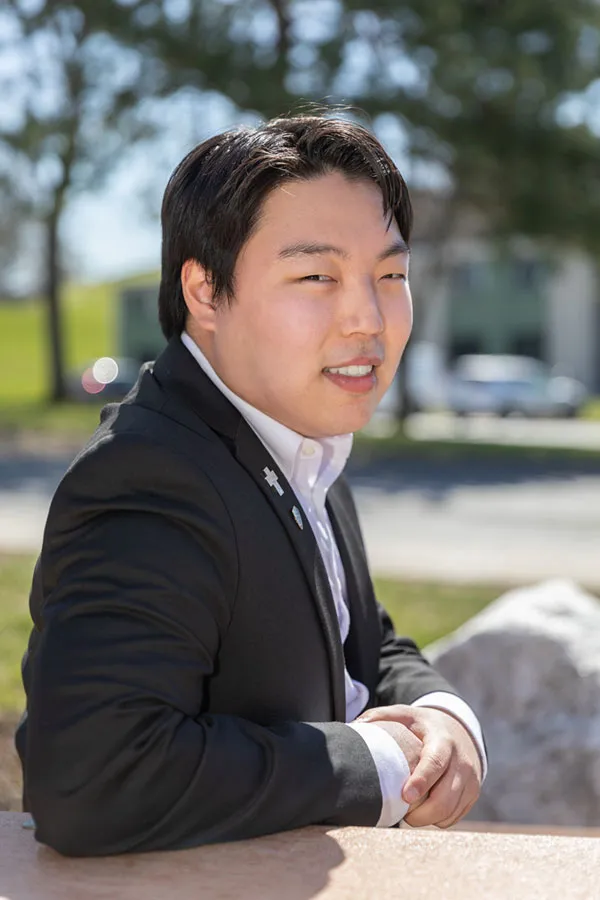 portrait of christian buonadonna sitting outside