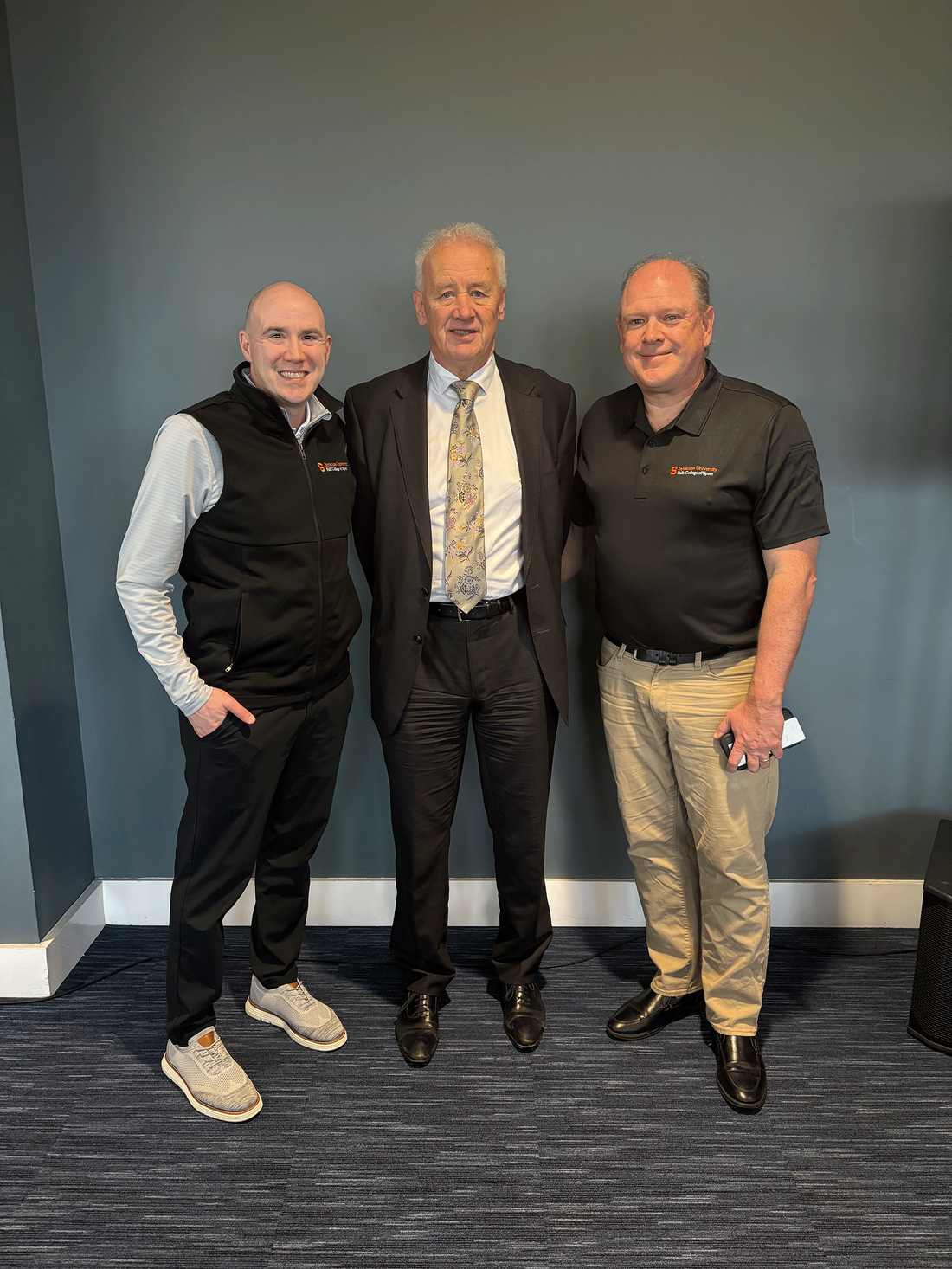 three men standing together at Oldham conference