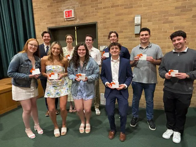 Sport management nine award winners standing together.