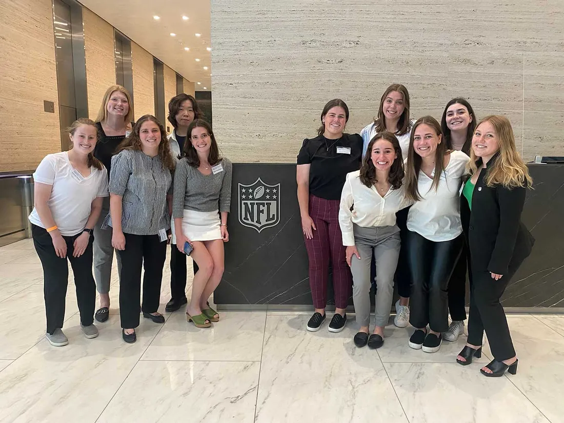 sport management womens organization standing together