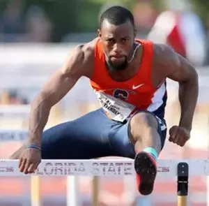 young man jumping hurdles at Paris olympics