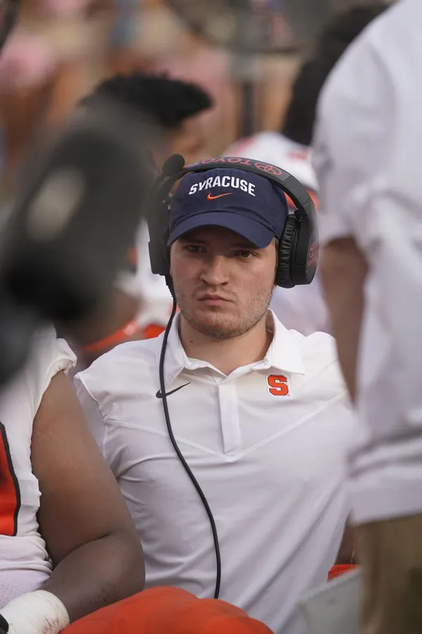 David sitting on the sidelines during football game