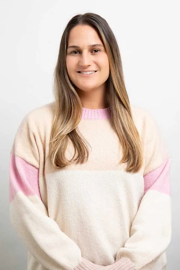 young woman with long blonde hair wearing a sweater