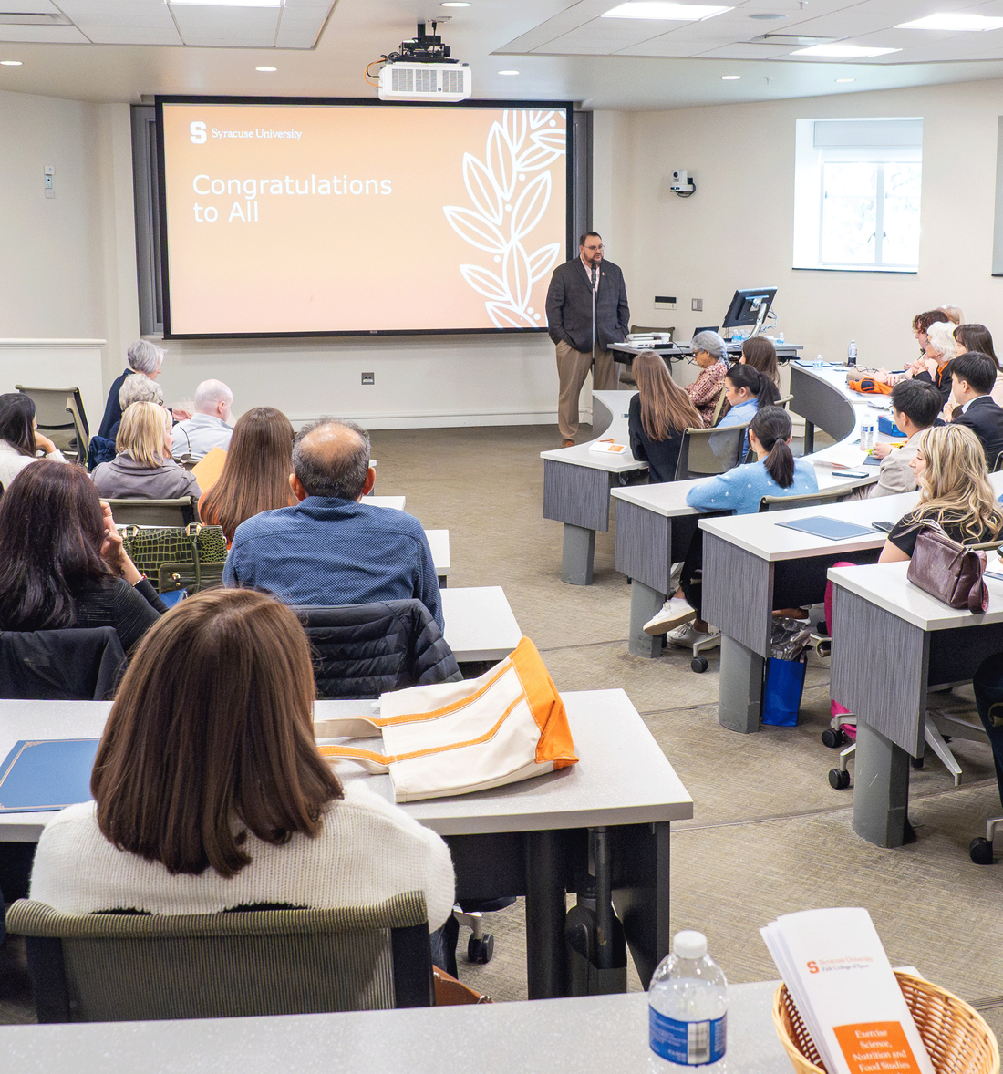 classroom with students looking at presentation