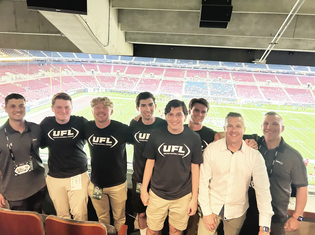 sport analytics students standing in a stadium