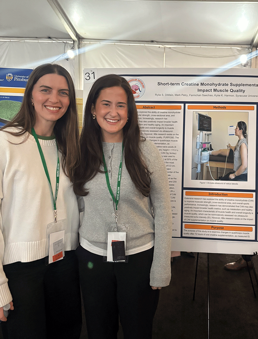 Rylie DiMaio standing next to Kylie Harmon at research presentation